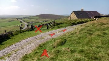 A photo of step 17 of the Axe Edge Walk route, with red arrows superimposed to show the way.