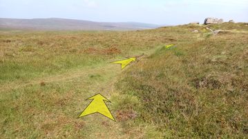 A photo of step 23 of the Axe Edge Walk route, with yellow arrows superimposed to show the way.
