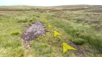 A photo of step 29 of the Axe Edge Walk route, with yellow arrows superimposed to show the way.