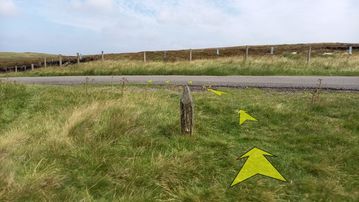 A photo of step 32 of the Axe Edge Walk route, with yellow arrows superimposed to show the way.