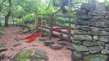 A photo of step 5 of the Bamford Edge Walk route, with red arrows superimposed to show the way.