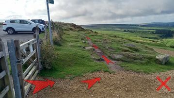 A photo of step 3 of the Burbage Rocks & Higger Tor Walk route, with red arrows superimposed to show the way.