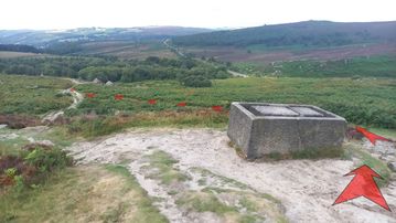 A photo of step 10 of the Burbage Rocks & Higger Tor Walk route, with red arrows superimposed to show the way.