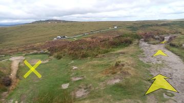 A photo of step 36 of the Burbage Rocks & Higger Tor Walk route, with yellow arrows superimposed to show the way.