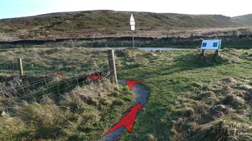 A photo of step 2 of the Cats Tor Walk route, with red arrows superimposed to show the way.