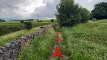 A photo of step 1 of the Chee Dale Walk route, with red arrows superimposed to show the way.