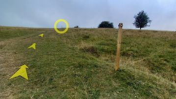 A photo of step 29 of the Chee Dale Walk route, with yellow arrows superimposed to show the way.