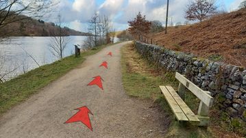 A photo of step 6 of the Fernilee Reservoir Walk route, with red arrows superimposed to show the way.