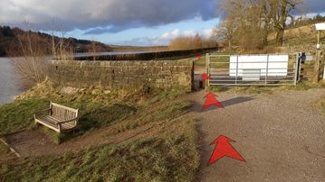 A photo of step 7 of the Fernilee Reservoir Walk route, with red arrows superimposed to show the way.