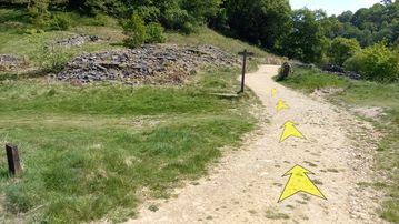 A photo of step 18 of the Shining Tor Walk route, with yellow arrows superimposed to show the way.