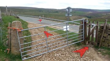 A photo of step 11 of the Three Shires Head Walk route, with red arrows superimposed to show the way.