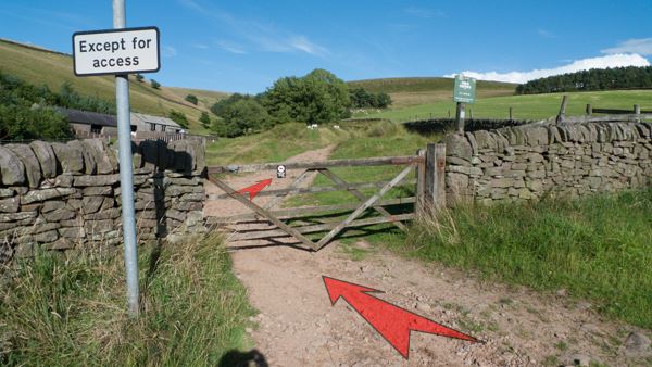 A photo of step 3 of the Three Shires Head route, with red arrows superimposed to show the way.