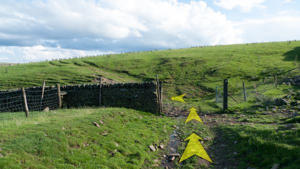 A photo of step 4 of the Three Shires Head route, with yellow arrows superimposed to show the way.