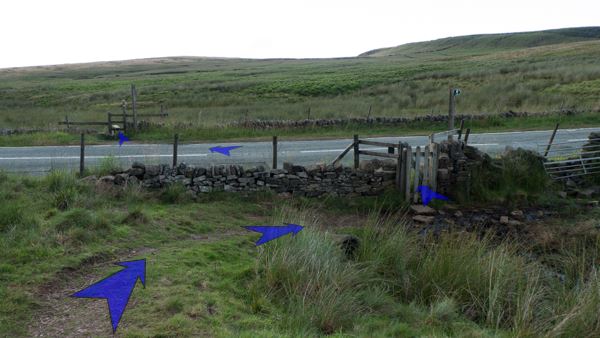 A photo of step 4 of the Three Shires Head route, with blue arrows superimposed to show the way.