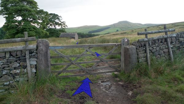 A photo of step 6 of the Three Shires Head route, with blue arrows superimposed to show the way.
