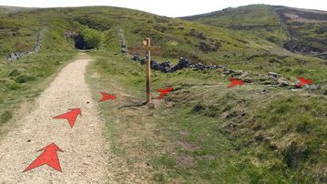 A photo of step 6 of the Wildmoorstone Valley Walk route, with red arrows superimposed to show the way.